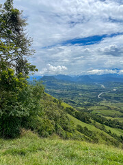 Naklejka premium Beautiful natural landscape of the Poblanco river in southwestern Antioquia, Colombia with mountains in the background aerial view.