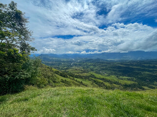 Beautiful natural landscape of the Poblanco river in southwestern Antioquia, Colombia with mountains in the background aerial view.