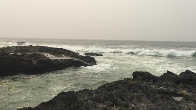 waves crashing on rocks