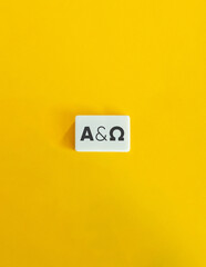 From Alpha to Omega Concept. Block Letter Tiles on Yellow Background