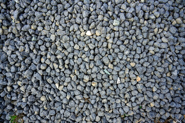 Pile of Gray Gravel Stones for Construction
Close-up view of a pile of small gray gravel stones, commonly used for construction, landscaping, or road paving purposes.
