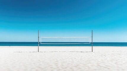 Beach volleyball court with sand perfectly raked, net up, and no people, under a clear blue sky.