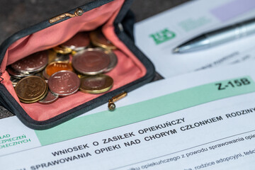 Poland documents. Application for care allowance for a person taking care of a sick family member. Form and a purse with small coins