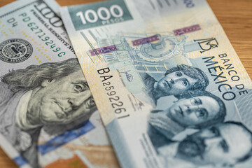 Mexico money , Exchange rate, peso vs dollar. Financial concept. 1000 Mexican pesos and 100 US...