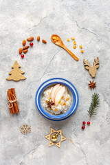  Traditional Scandinavian-style rice porridge, pudding in Christmas style with decoration, close up, top view