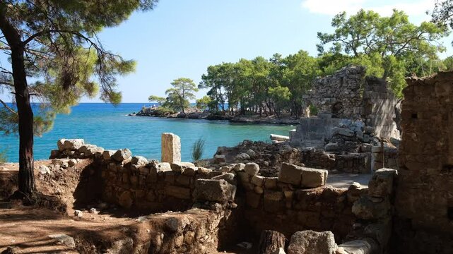 The ancient city of Faselis or Phaselis.  It is an ancient Greek and Roman settlement in Lycia. Ancient cities on the Mediterranean coast of T&uuml;rkiye.  Antalya, Turkey - 4k video 