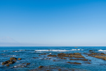 Calm Ocean Waves Under Clear Blue Sky