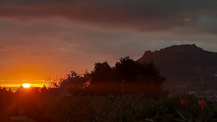 Sky, clouds, orange, yellow, blue, nature, outdoor, outside, island, beach, coastline, coast, landscape, rock, mountain, cliff, relax, peace, paradise, madeira island, island, tree