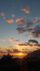 Sky, clouds, orange, yellow, blue, nature, outdoor, outside, island, beach, coastline, coast, landscape, rock, mountain, cliff, relax, peace, paradise, madeira island, island, tree