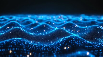 Abstract blue glowing particle wave background.