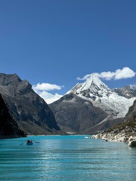 lake paron in huaraz, peru - snow capped mountains with blue lake