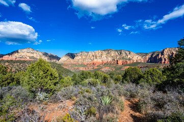 Fototapeta premium Hiking in the Red Rock State Park area in Coconino National Forest near Sedona, Arizona in the fall of 2024 including Seven Sacred Pools and various geological formations