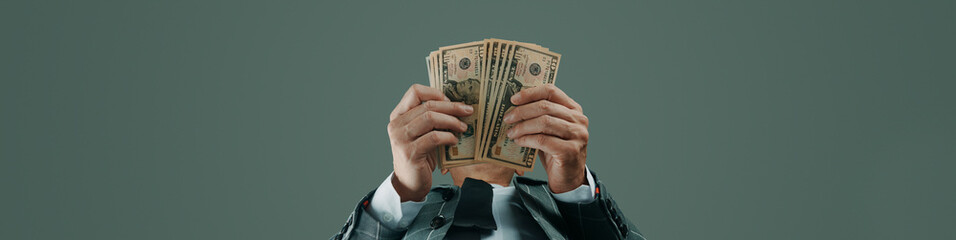 businessman with some dollar notes, banner format