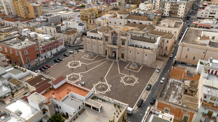 Fototapeta premium Aerial view of Manfredonia Cathedral. It is a Roman Catholic cathedral located in the historic center of the town in the province of Foggia, Puglia, Italy. It is dedicated to Saint Laurence of Siponto