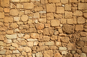 Old light stone wall close up