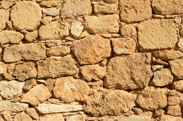 Old light stone wall close up