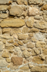 Old light stone wall close up