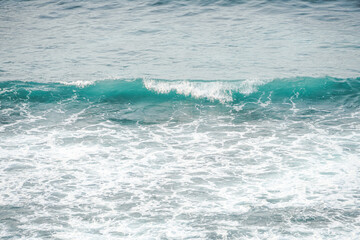Dangerous high tide wave on the beach. Watu Karung beach, Pacitan, East Java, Indonesia.