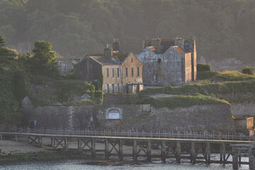 Castle on the Shore – A grand castle gazes over still waters, its reflection shimmering like a...