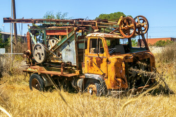 Fototapeta premium old rusty abandoned service lorry in the field in the summer
