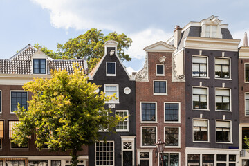 Canal houses with historic facades in the center of Amsterdam.