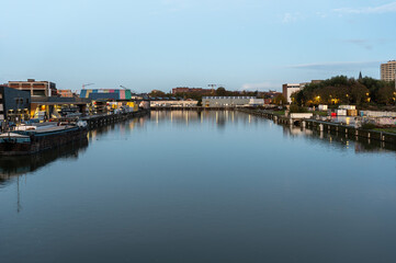 Water reflections in the industrial zone of the Quai du Canal an Boestebroeck in Anderlecht, Brussels Capital Region, Belgium