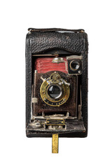 old 20th century photo camera with retractable lens on light background