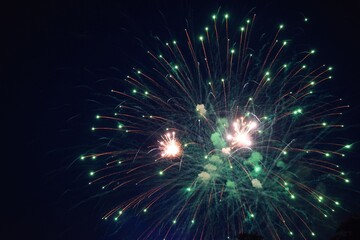 Blue hour with green exploding fireworks