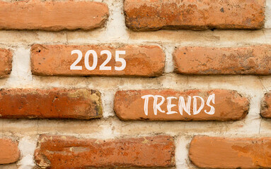 Planning 2025 trends new year symbol. Concept words 2025 Trends on beautiful brown brick wall. Beautiful brown brick wall background. Business 2025 trends new year concept. Copy space.