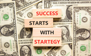 Success starts with strategy symbol. Concept words Success starts with strategy on beautiful wooden...