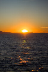 Obraz premium Dark sunset on the sea with mountains 2