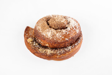 Close up spiral bun with poppy seed sprinkle , isolated on white background