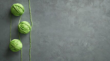 Green Yarn Balls on Grey Background - Craft Supplies