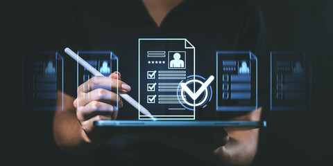 Digital resume review with stylus on a tablet and holographic documents displayed in the background. .