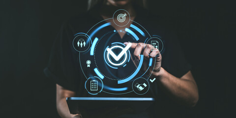 Person using tablet with digital checklist interface, futuristic