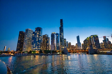 Fototapeta premium Amazing night view of Downtown Chicago skyscrapers from a cruise along the city river