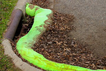 close-up of filter sock on pavement and leaves to prevent stormwater runoff prevention sewer system drain environment background