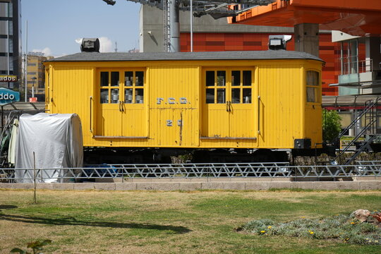Yellow Vintage FCG Railway Carriage in La Paz City Centre close to the Old Railway Station. La Paz, Bolivia, October 10, 2023. 