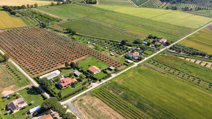 Aerial view of a beautiful Tuscany countryside landscape in spring season. Meadows and blue sky, Italy