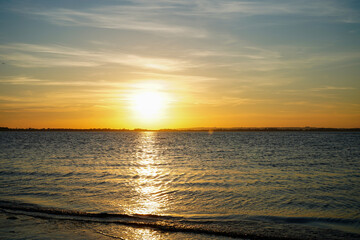 Setting sun over a sandy beach in the South of England        