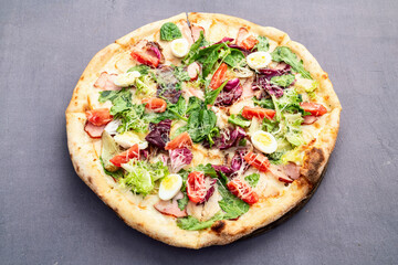 Italian pizza caesar with eggs salad chicken tomatoes and mozzarella photography. top view