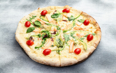 Italian pizza with avocado salmon  tomatoes and mozzarella photography. top view