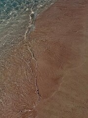 Stunning Pink Beach with Crystal Clear Waters and Soft Sands