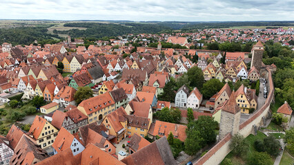 Obraz premium Rothenburg ob der Tauber on the romantic route, the old town and watchtowers within the historical castle. Aerial photography by a drone