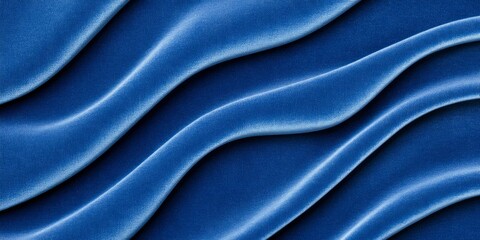 Obraz premium Luxurious deep blue velvet texture with soft folds showcasing rich shadows and elegant fabric composition