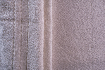 Beige gold velvet background or velour flannel texture made of cotton or wool with soft fluffy velvety satin fabric cloth metallic color material