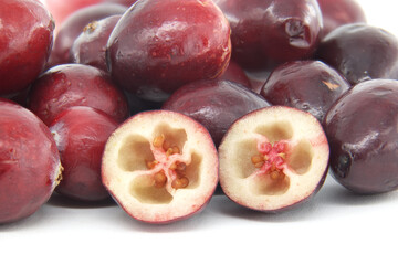 Fresh Ripe Cranberries with a Focus on Halved Fruit