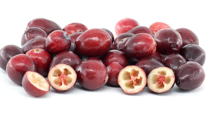 Fresh Whole and Sliced Cranberries on White Background