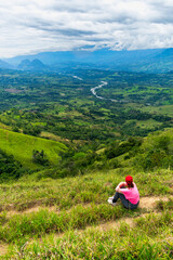 Latina woman hiker enjoys the mountains in Colombia