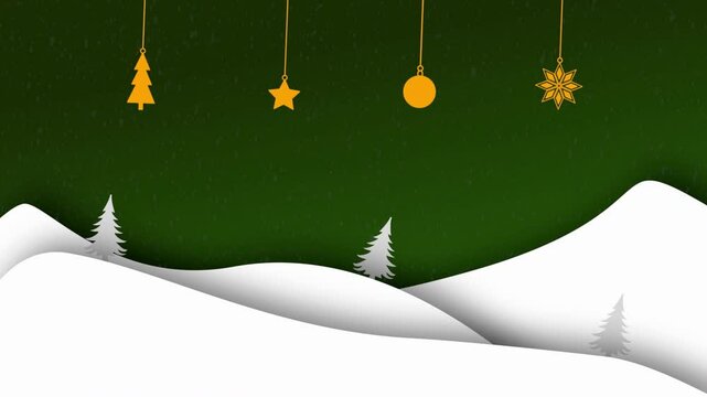 Orange ornaments hang above snowy hills and trees.